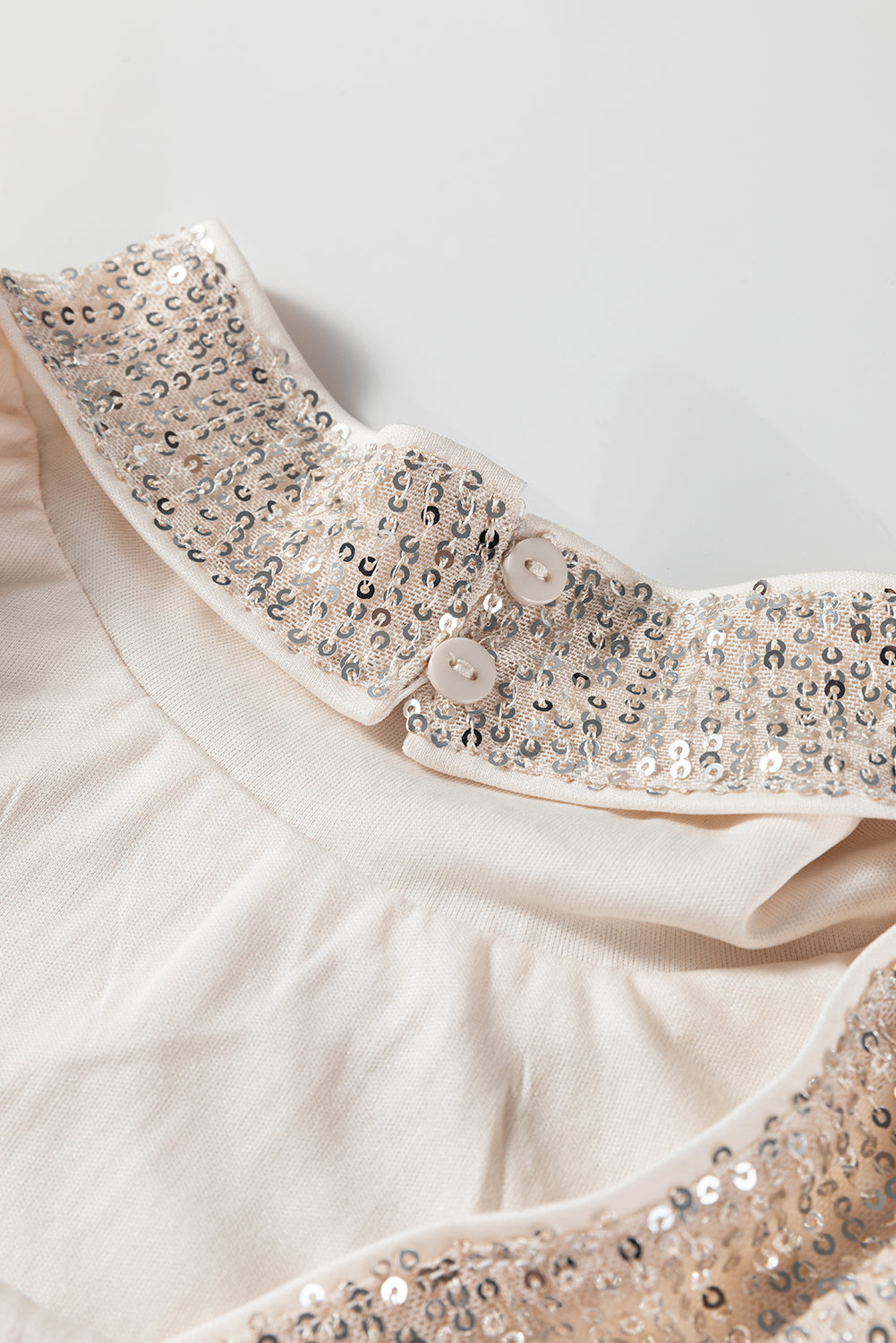 Jet Stream Sequin Mock Neck Drape Open Back Bell Sleeve Top